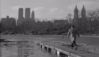 Movie still from “The Manchurian Candidate” (1962), directed by John Frankenheimer – A man walking on a pier in the middle of a lake; Extreme Wide shot, Over the shoulder angle