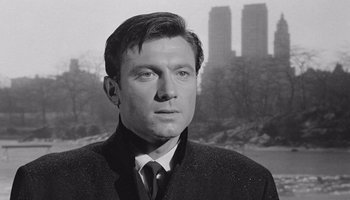 Movie still from “The Manchurian Candidate” (1962), directed by John Frankenheimer – A black and white photo of a man wearing a suit and tie; Close Up shot, Low angle