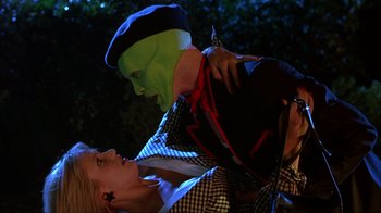 Movie still from “The Mask” (1994), directed by Chuck Russell – A man and a woman dressed in costumes and makeup; Close Up shot, Over the shoulder angle