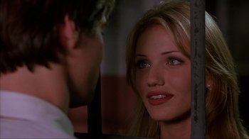 Movie still from “The Mask” (1994), directed by Chuck Russell – A woman's face and a man's face; Close Up shot, Over the shoulder angle