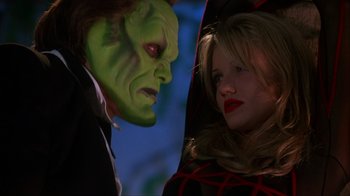 Movie still from “The Mask” (1994), directed by Chuck Russell – A man and a woman dressed in costumes; Close Up shot, Over the shoulder angle