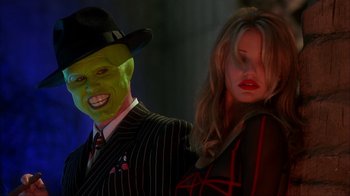 Movie still from “The Mask” (1994), directed by Chuck Russell – A man and a woman dressed up in costumes; Close Up shot, Over the shoulder angle