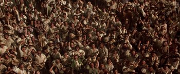 Movie still from “The Mask of Zorro” (1998), directed by Martin Campbell – A large group of people sitting in a stadium; Wide shot, High angle