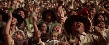 Movie still from “The Mask of Zorro” (1998), directed by Martin Campbell – A group of people are gathered together in a crowd; Medium shot, High angle