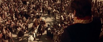 Movie still from “The Mask of Zorro” (1998), directed by Martin Campbell – A large group of men on horses in a field; Wide shot, High angle