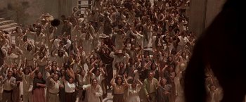 Movie still from “The Mask of Zorro” (1998), directed by Martin Campbell – A large group of people standing in a room; Extreme Wide shot, High angle