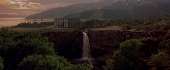 Movie still from “The Mask of Zorro” (1998), directed by Martin Campbell – A view of a waterfall in the middle of a valley; Extreme Wide shot, High angle