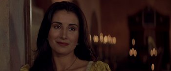 Movie still from “The Mask of Zorro” (1998), directed by Martin Campbell – A person wearing a yellow dress; Close Up shot, Over the shoulder angle