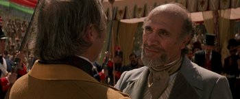 Movie still from “The Mask of Zorro” (1998), directed by Martin Campbell – A man with a long beard and a man with a long beard and a man with a long beard; Close Up shot, Over the shoulder angle