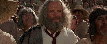 Movie still from “The Mask of Zorro” (1998), directed by Martin Campbell – An old man with a long white beard and a red tie; Close Up shot, Low angle