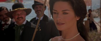 Movie still from “The Mask of Zorro” (1998), directed by Martin Campbell – A person holding an umbrella; Close Up shot, Over the shoulder angle