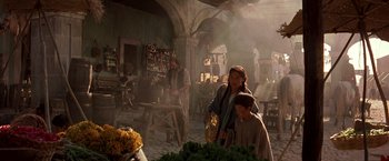 Movie still from “The Mask of Zorro” (1998), directed by Martin Campbell – A woman and a child in a kitchen; Wide shot, Over the shoulder angle