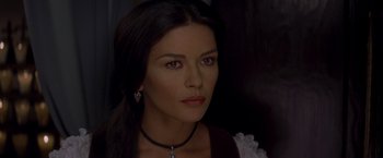 Movie still from “The Mask of Zorro” (1998), directed by Martin Campbell – A person wearing a necklace; Close Up shot, Over the shoulder angle