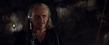 Movie still from “The Mask of Zorro” (1998), directed by Martin Campbell – An older man with long hair and a mustache; Close Up shot, Low angle