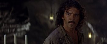 Movie still from “The Mask of Zorro” (1998), directed by Martin Campbell – A person wearing a shirt; Close Up shot, Over the shoulder angle