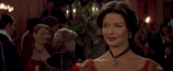 Movie still from “The Mask of Zorro” (1998), directed by Martin Campbell – A person wearing a necklace; Close Up shot, Over the shoulder angle