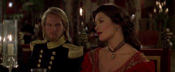 Movie still from “The Mask of Zorro” (1998), directed by Martin Campbell – A man and a woman dressed in medieval garb; Close Up shot, Over the shoulder angle