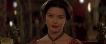 Movie still from “The Mask of Zorro” (1998), directed by Martin Campbell – A person wearing a necklace; Close Up shot, Over the shoulder angle