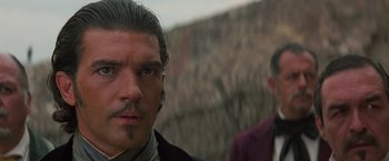 Movie still from “The Mask of Zorro” (1998), directed by Martin Campbell – A person with a mustache; Close Up shot, Over the shoulder angle