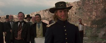 Movie still from “The Mask of Zorro” (1998), directed by Martin Campbell – A man wearing a hat and a uniform; Close Up shot, Over the shoulder angle