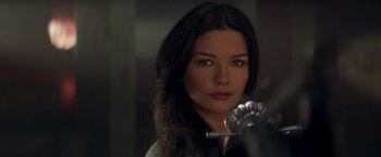 Movie still from “The Mask of Zorro” (1998), directed by Martin Campbell – A beautiful woman with long black hair holding a fan; Close Up shot, Over the shoulder angle