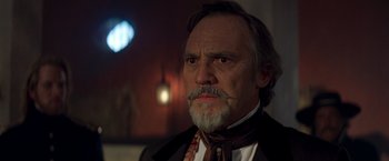 Movie still from “The Mask of Zorro” (1998), directed by Martin Campbell – An older man with a mustache and a beard; Close Up shot, Low angle