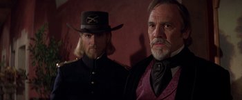 Movie still from “The Mask of Zorro” (1998), directed by Martin Campbell – Two men dressed up in costumes and hats; Medium shot, Low angle