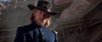 Movie still from “The Mask of Zorro” (1998), directed by Martin Campbell – A person wearing a uniform and a hat; Close Up shot, Over the shoulder angle