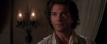 Movie still from “The Mask of Zorro” (1998), directed by Martin Campbell – A person with long hair; Close Up shot, Over the shoulder angle