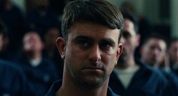 Movie still from “The Master” (2012), directed by Paul Thomas Anderson – A person wearing a blue shirt; Close Up shot, Low angle
