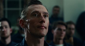 Movie still from “The Master” (2012), directed by Paul Thomas Anderson – A person looking up at something; Close Up shot, Low angle