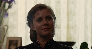 Movie still from “The Master” (2012), directed by Paul Thomas Anderson – A person wearing a necklace; Close Up shot, Over the shoulder angle