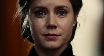 Movie still from “The Master” (2012), directed by Paul Thomas Anderson – A woman's face with blue eyes; Close Up shot, Over the shoulder angle