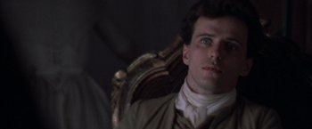 Movie still from “The Mission” (1986), directed by Roland Joffé – A person sitting in a chair; Close Up shot, Over the shoulder angle