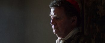 Movie still from “The Mission” (1986), directed by Roland Joffé – A person wearing a hat; Close Up shot, Low angle