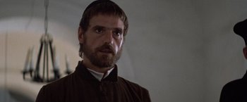 Movie still from “The Mission” (1986), directed by Roland Joffé – A person with a beard; Close Up shot, Over the shoulder angle