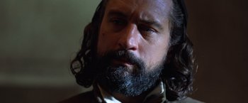 Movie still from “The Mission” (1986), directed by Roland Joffé – A person with a beard; Close Up shot, Low angle