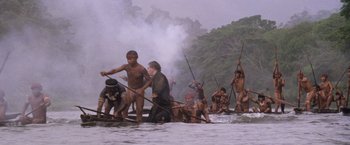 Movie still from “The Mission” (1986), directed by Roland Joffé – A group of people in the water on canoes; Extreme Wide shot, High angle