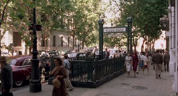 Movie still from “The Motorcycle Diaries” (2004), directed by Walter Salles – A group of people walking down a sidewalk; Extreme Wide shot, High angle