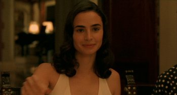 Movie still from “The Motorcycle Diaries” (2004), directed by Walter Salles – A beautiful young lady with long dark hair; Close Up shot, Over the shoulder angle