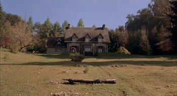 Movie still from “The Motorcycle Diaries” (2004), directed by Walter Salles – An old house with a log in the middle of a field; Extreme Wide shot, Low angle
