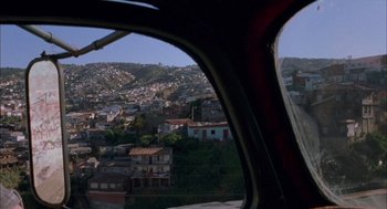 Movie still from “The Motorcycle Diaries” (2004), directed by Walter Salles – A view of a city from a helicopter window; Extreme Wide shot, High angle