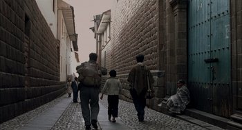 Movie still from “The Motorcycle Diaries” (2004), directed by Walter Salles – A group of people walking down a sidewalk; Wide shot, Low angle