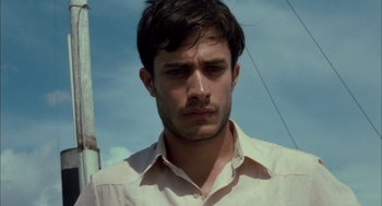 Movie still from “The Motorcycle Diaries” (2004), directed by Walter Salles – A person wearing a white shirt; Close Up shot, Low angle