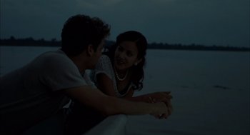 Movie still from “The Motorcycle Diaries” (2004), directed by Walter Salles – A man and a woman sitting next to each other on the beach; Medium shot, Low angle