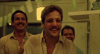 Movie still from “The Motorcycle Diaries” (2004), directed by Walter Salles – A group of men standing next to each other in a room; Close Up shot, Low angle