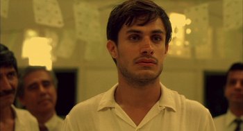 Movie still from “The Motorcycle Diaries” (2004), directed by Walter Salles – A young man in a white shirt looking to his left; Close Up shot, Low angle