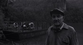 Movie still from “The Motorcycle Diaries” (2004), directed by Walter Salles – An old man standing in front of a bridge; Medium shot, Low angle