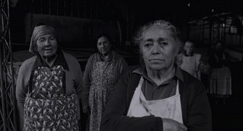 Movie still from “The Motorcycle Diaries” (2004), directed by Walter Salles – A group of women standing next to each other; Medium shot, Low angle