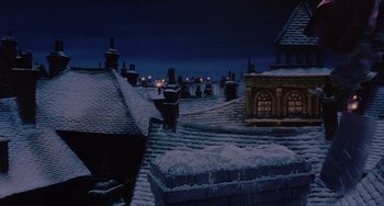 Movie still from “The Muppet Christmas Carol” (1992), directed by Brian Henson – A view of a snowy rooftops at night time; Extreme Wide shot, Low angle